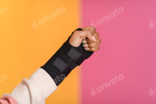Preview: hand injury. a female injured hand on a yellow background