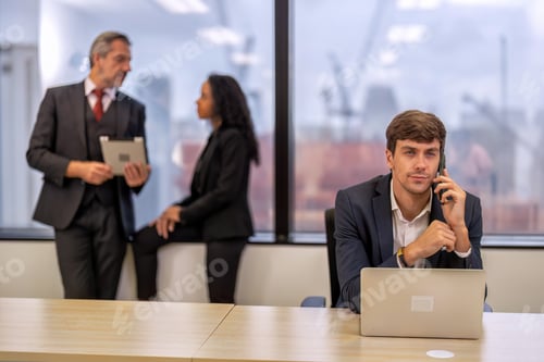 Preview: Staff employee sitting use mobile phone call in work place