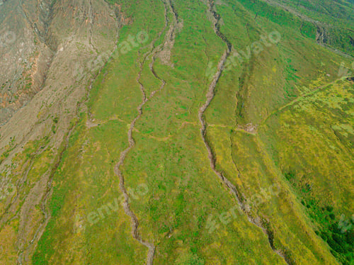 Preview: Aerial drone view of green savanna near Mount Sinabung at Berastagi in North Sumatra, Indonesia.