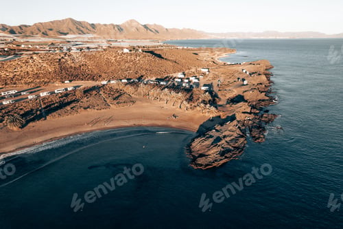 Preview: an aerial view of a beach and mountains in a desert