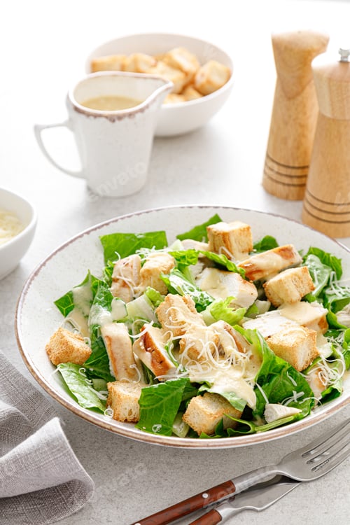 Preview: Caesar salad with parmesan cheese, grilled chicken meat and croutons