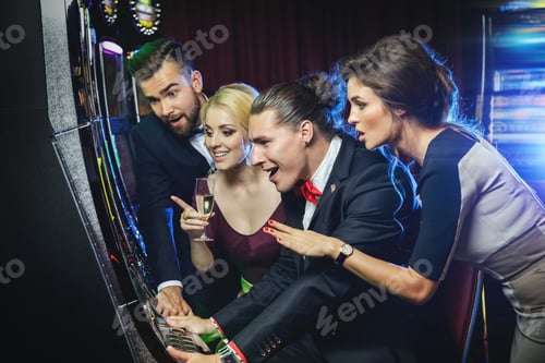 Preview: Group of friends playing slot machines in casino