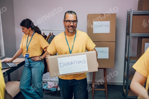 Preview: Portrait of a middle aged man working in community charity donation center