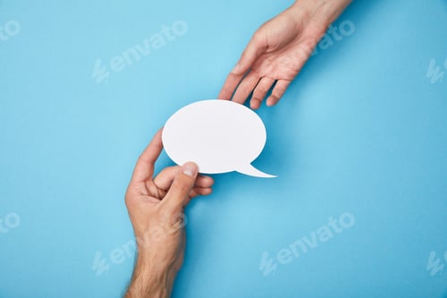 Preview: cropped view of man giving white empty speech bubble to woman on blue background