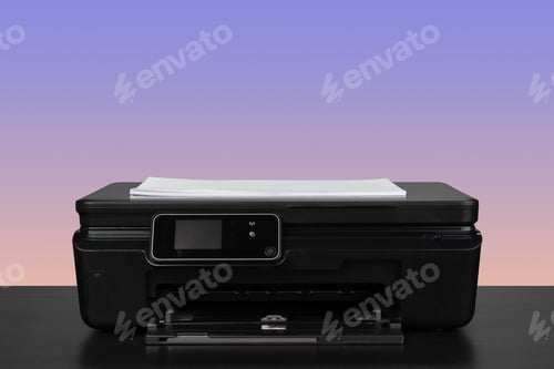 Preview: Home laser printer on desk against purple background