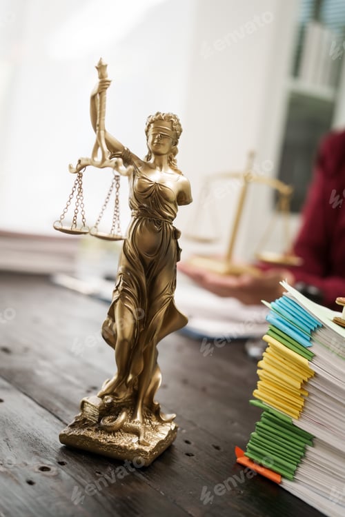 Preview: A male lawyer is working at his desk on online judicial review,focusing on justice,fairness,legal