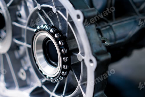Preview: Close-up of parts of a clean engine block removed from a car for repair which lie on a table