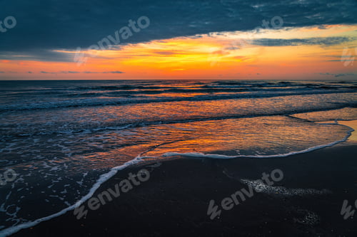 Preview: Colorful sunrise on the sea sandy beach