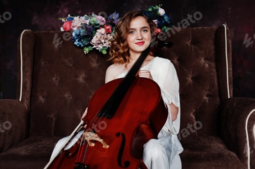 Preview: Gilrl musician in white dress with double bass