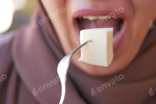Preview: women eating Cheese cubes closeup
