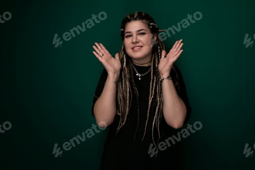 Preview: Woman With Dreadlocks Standing Against Green Background