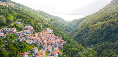 Preview: Arial view on mountain Italian village, Garzeno. High angle view of houses with red roofs amoung