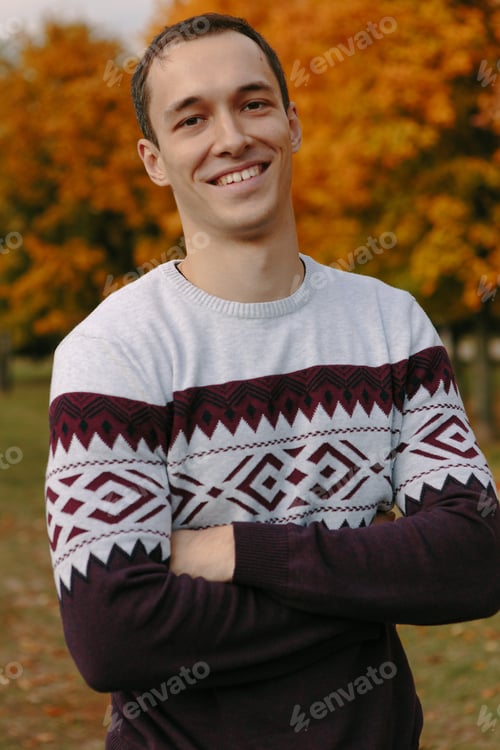 Preview: Handsome Guy In A Sweater In Autumn Park