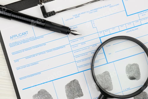Preview: Fingerprints card police form on A4 tablet lies on office table with pen and magnifying glass