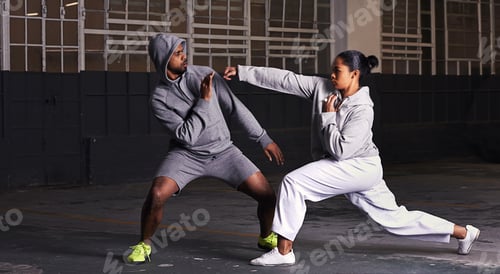 Preview: Everybody was kung-fu fighting. A young man and woman doing fight training.