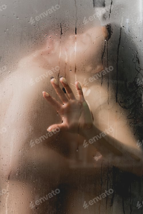 Preview: selective focus of sexy couple hugging and kissing in shower cabin