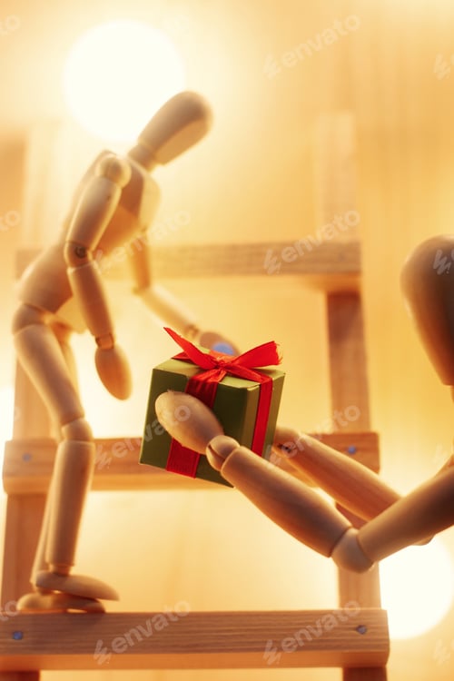 Preview: wooden toy giving gift box sitting on christmas tree with retro lights