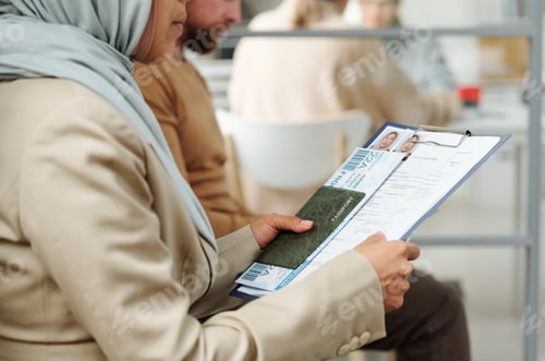 Preview: Muslim Woman Holding Documents At Office