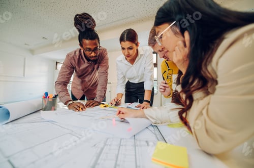 Preview: Diverse group of engineers or architects having a meeting in an office