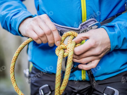 Preview: Rock climber tying rope