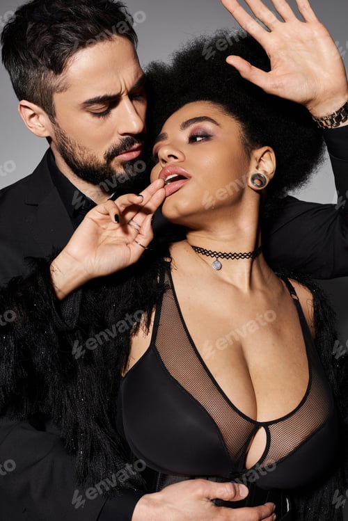 Preview: Passionate embrace of a loving couple with striking allure and confident expressions at night