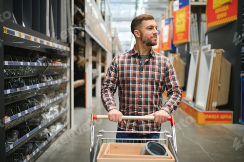 Preview: Portrait of happy mature man standing in hardware store