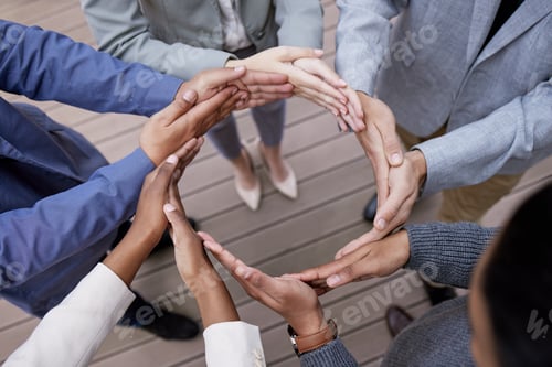Preview: Shot of a group of unrecognizable businesspeople forming a circle with their hands outside
