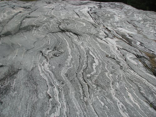 Preview: closeup shot of a gray and white marble surface rock nearby the fjord of Norway