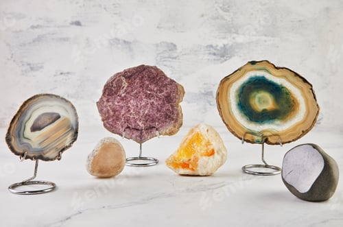 Vista previa: Collection of semi-precious stones of different colors and patterns on white background