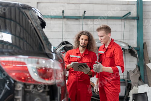 Preview: Team car mechanic man checking and discussing rear window broken of car at garage auto service