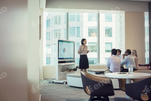 Preview: Business people listening to presentation