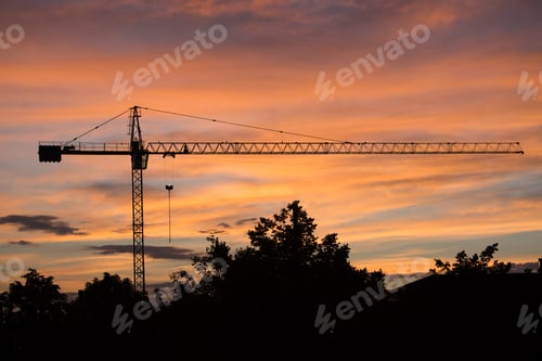 Preview: Silhouette of the construction site on sunset background
