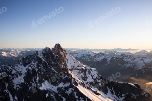 Preview: Aerial View of Remote Canadian Mountain Landscape during sunny sunrise