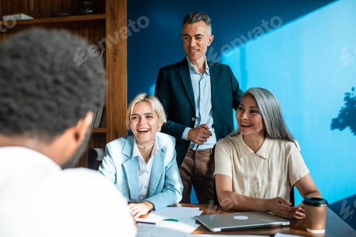 Preview: cinematic image of a multiethnic business team