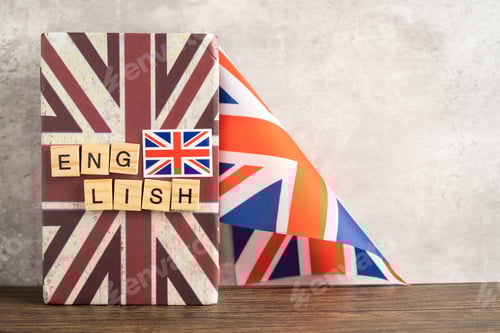 Preview: Word English on book with United Kingdom flag, learning English language courses concept.