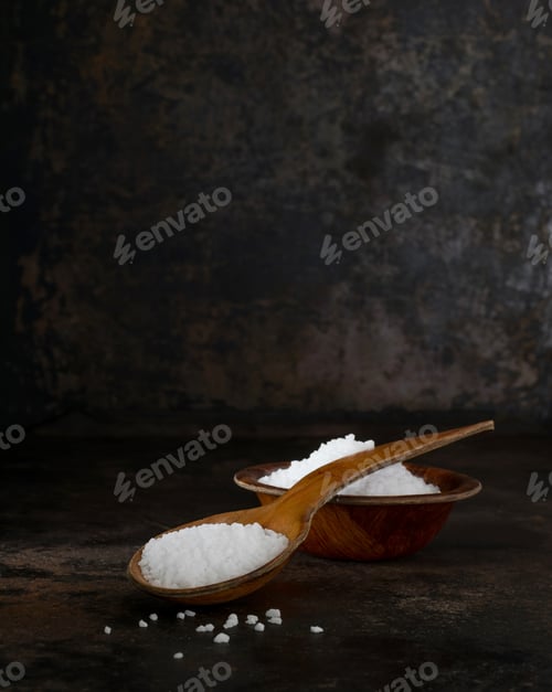 Preview: A wooden spoon and bowl of salt crystals