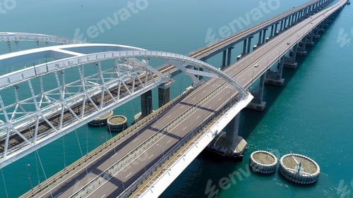 Preview: Beautiful suspension bridge over blue water. Shot. Highway on large suspension bridge passing
