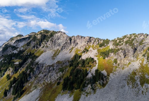Preview: Rocky Mountain Summit Landscape With Green Slopes Under Blue Sky, British Columbia, Canada