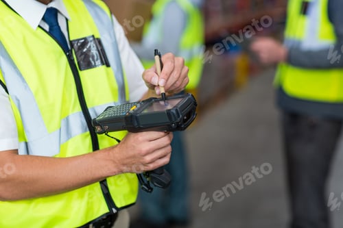 Preview: Warehouse worker using barcode scanner machine