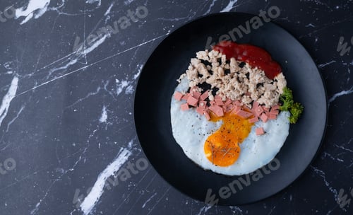 Preview: homemade American breakfast, fried egg, sausages, and minced pork with ketchup tomato