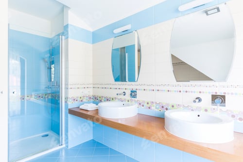 Preview: Blue bathroom with double sinks