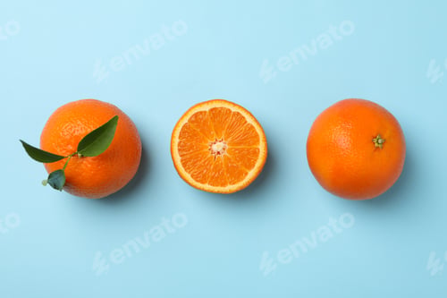 Preview: Ripe sweet mandarins on blue background, top view