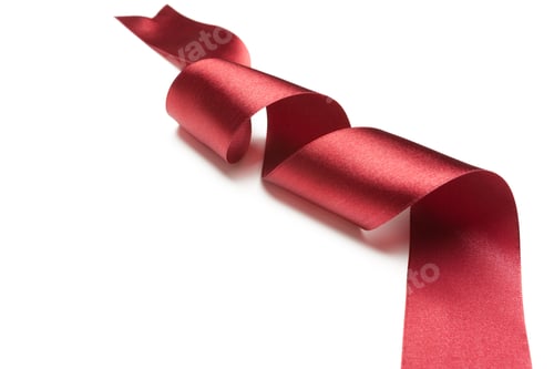 Preview: Red ribbon twisted on a plain background for decoration or crafting
