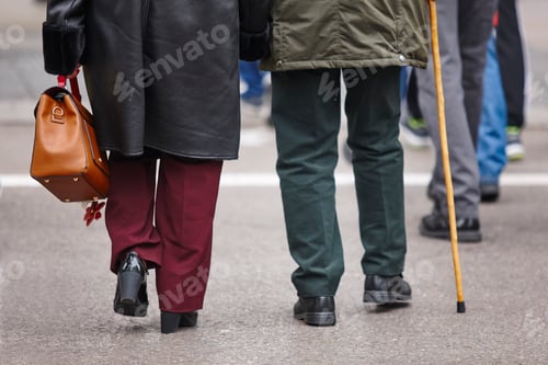 Preview: Elderly people croosing a street. Pensioner, adult care. Horizontal