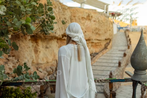 Preview: Portrait of a beautiful woman in Arabic clothing in Egypt during sunset.