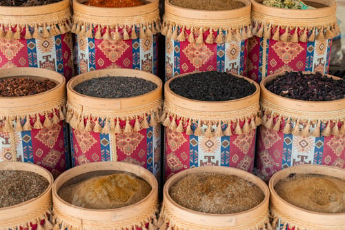 Preview: Turkish spices and herbs displayed in wooden bowls: saffron, sumac, thyme, isot