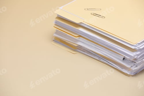 Preview: File folders with documents and paper clips on pale yellow background, closeup. Space for text