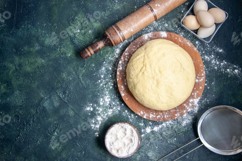 Preview: top view raw dough with white flour and eggs on dark-blue background pastry bake cake pie raw fresh