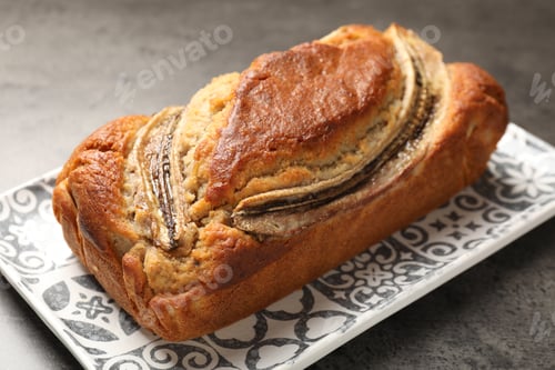 Preview: Delicious banana bread on grey table, closeup