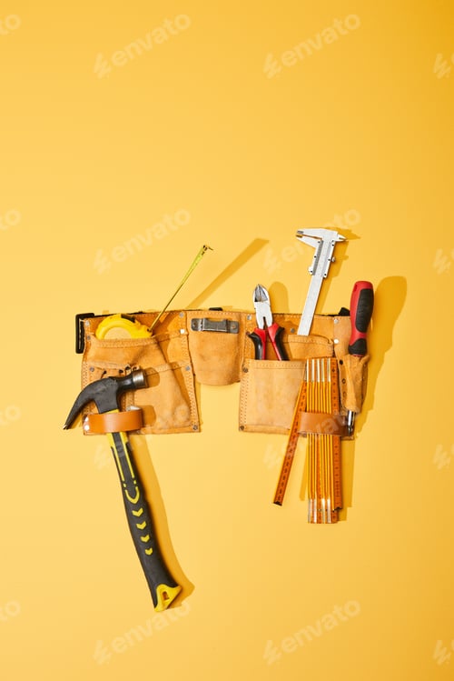 Preview: top view of tool belt with hammer, measuring tape, pliers, calipers, screwdriver and folding ruler